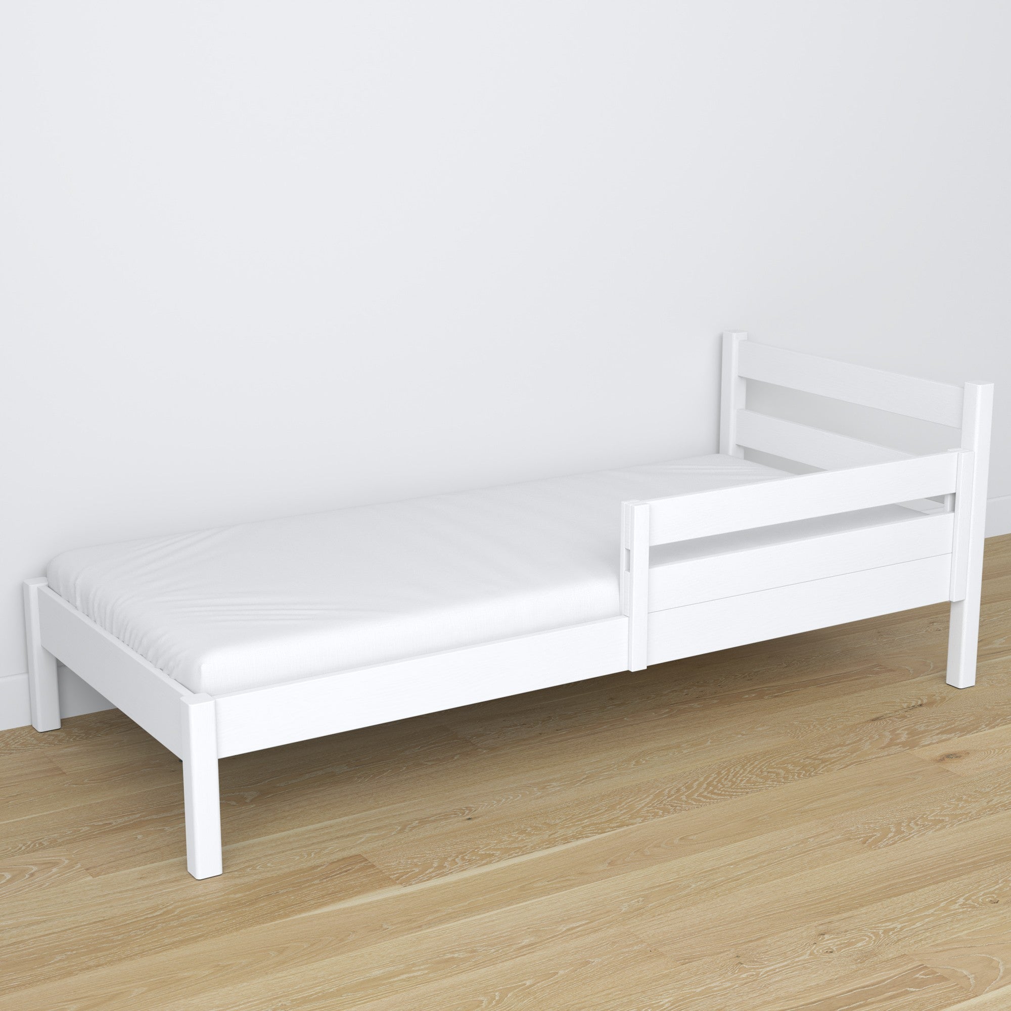 Barrière anti-chute blanc montée sur le lit – gros plan